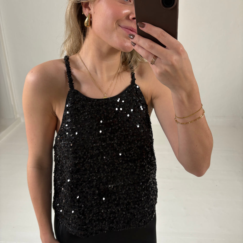 
                      
                        GLITTER HALTER TOP BLACK
                      
                    