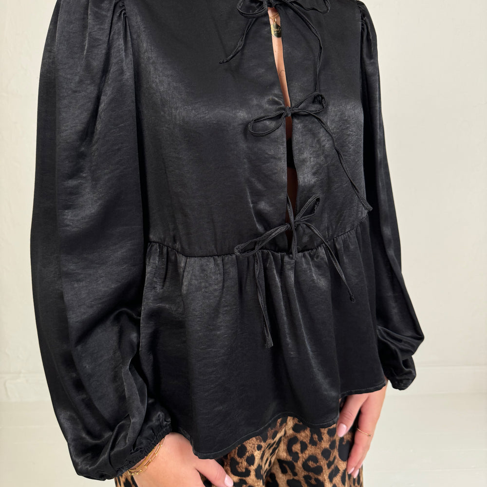 BLOUSE MET STRIKJES ZWART